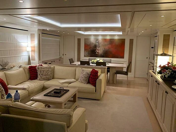 a living room with a white couch aboard LADY ALINA Yacht for Sale