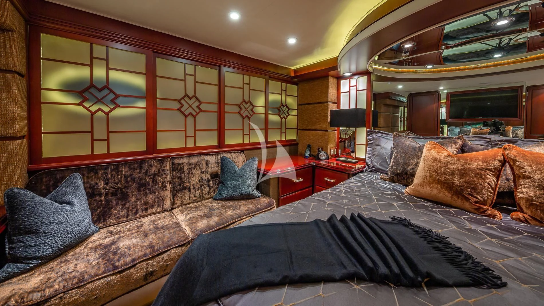 a bedroom with a bed and a couch aboard DESTINY Yacht for Sale