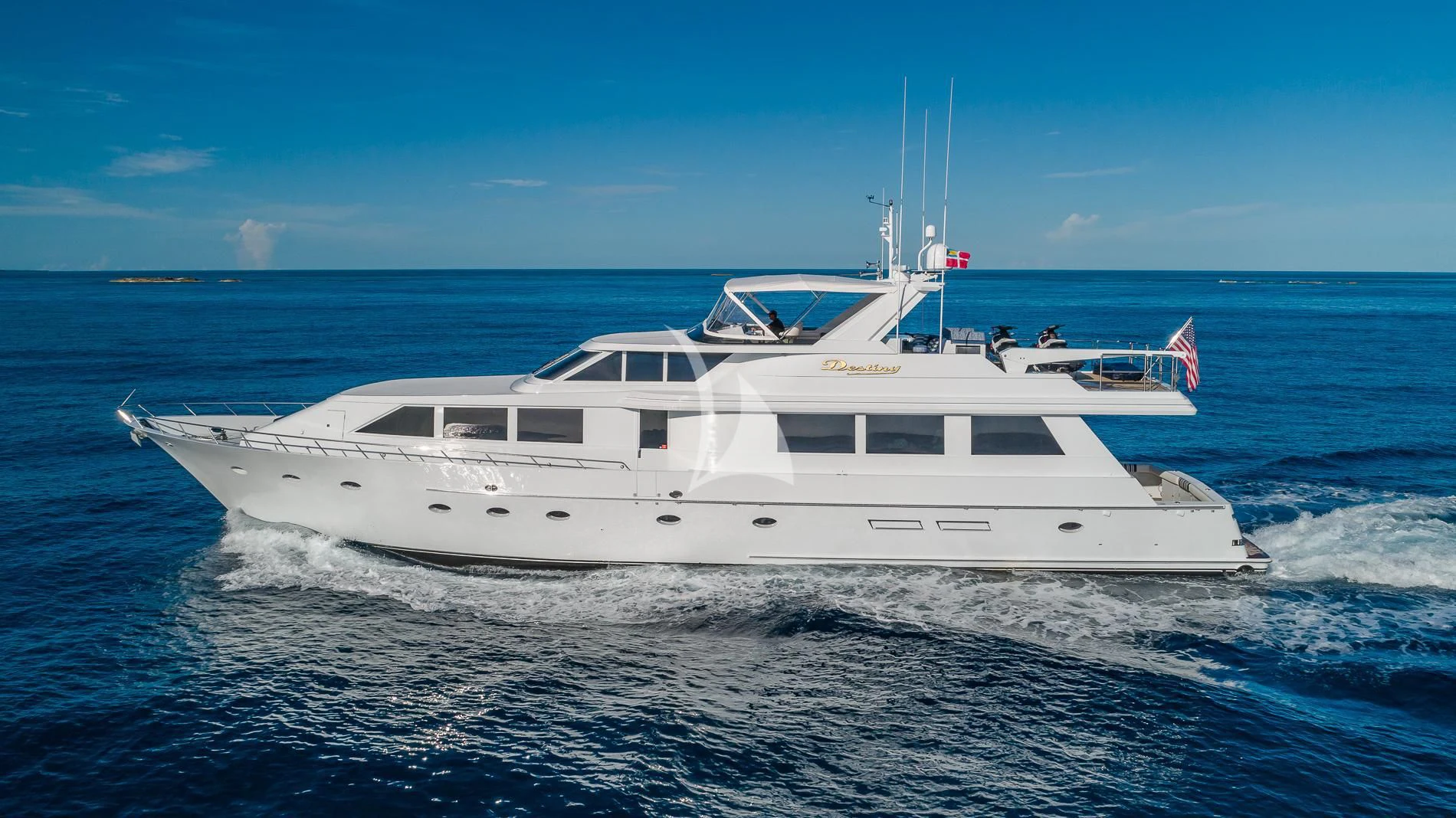 a white yacht in the water aboard DESTINY Yacht for Sale