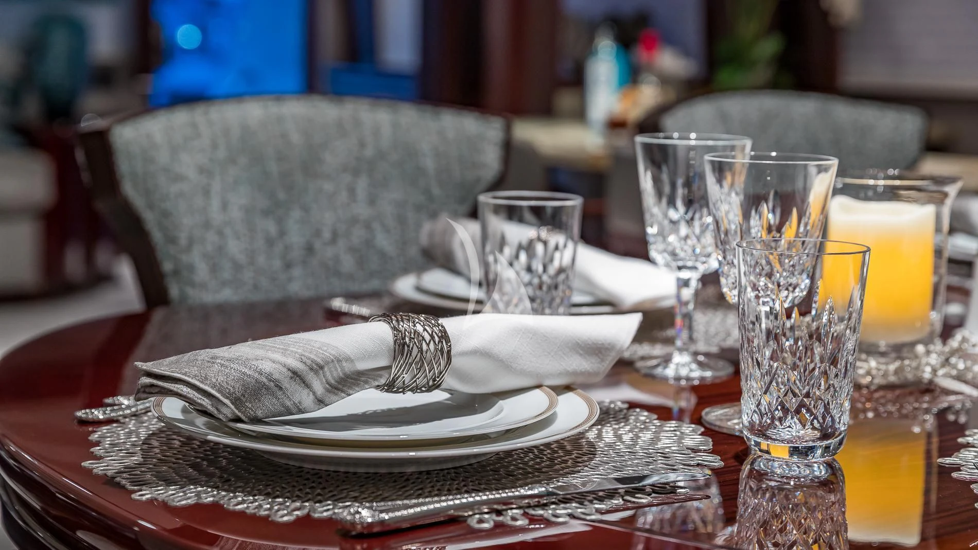 a plate of food and glasses on a table aboard DESTINY Yacht for Sale