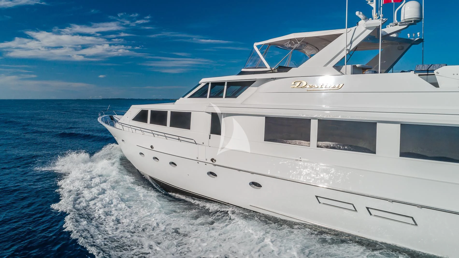 a white yacht on the water aboard DESTINY Yacht for Sale