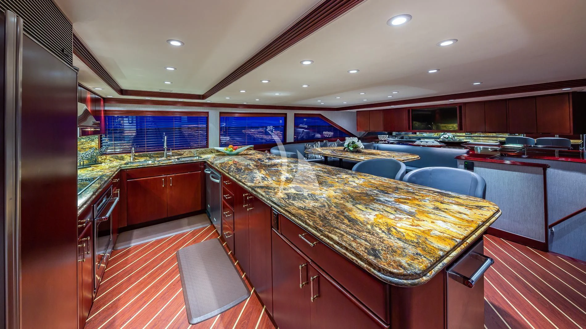 a large kitchen with a bar and bar aboard DESTINY Yacht for Sale