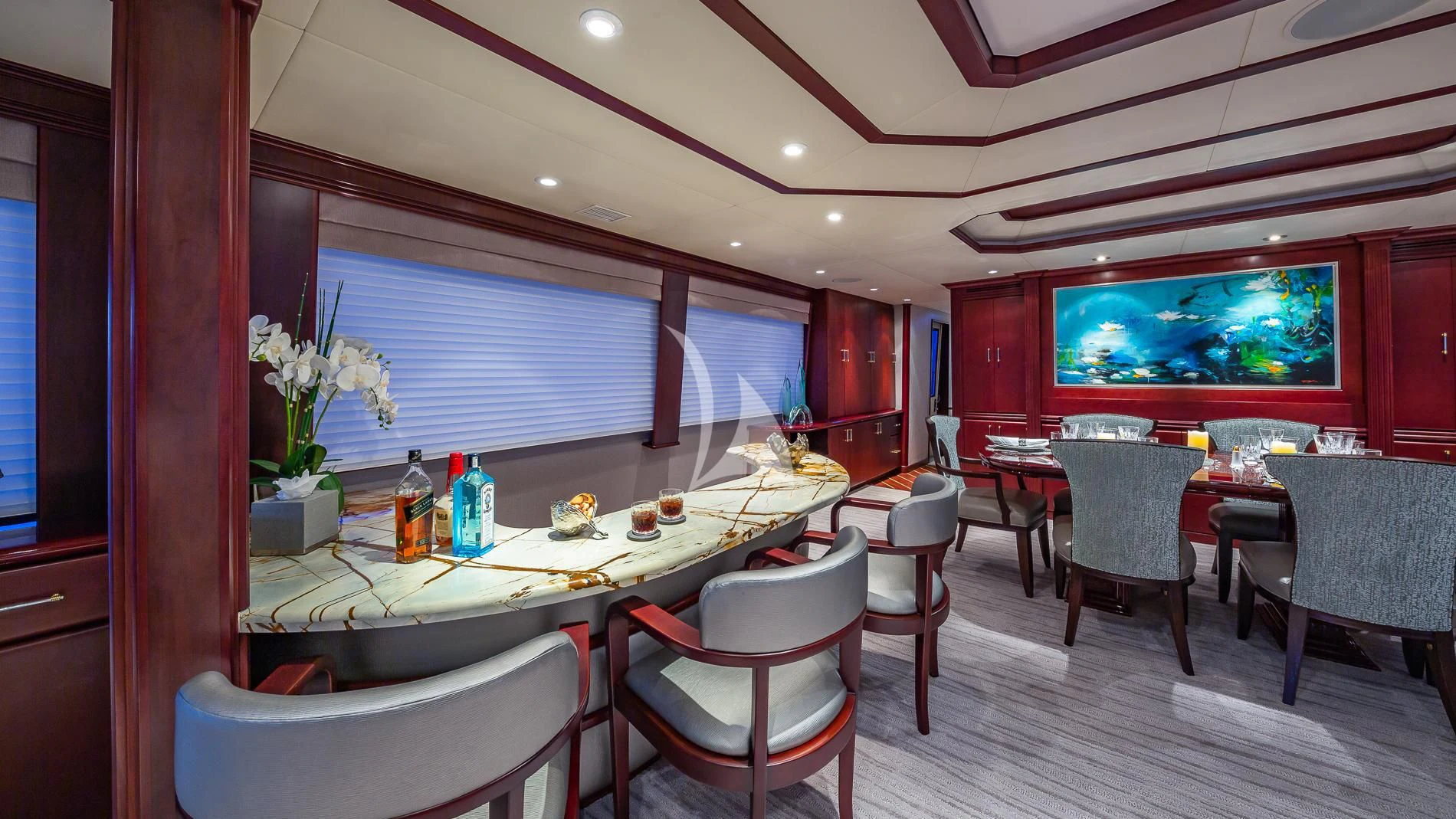 a room with a table and chairs aboard DESTINY Yacht for Sale