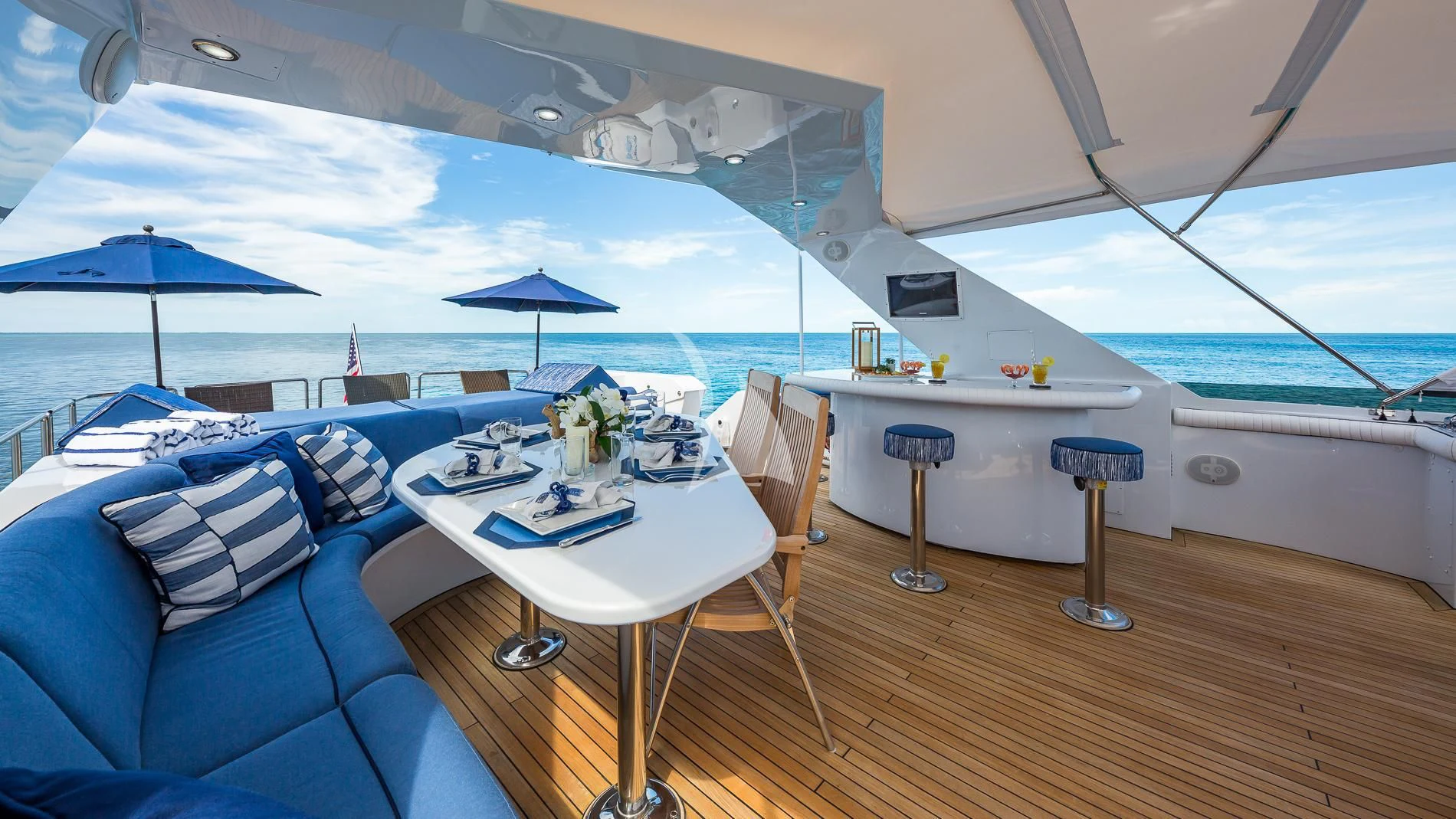 a room with a table and chairs aboard DESTINY Yacht for Sale