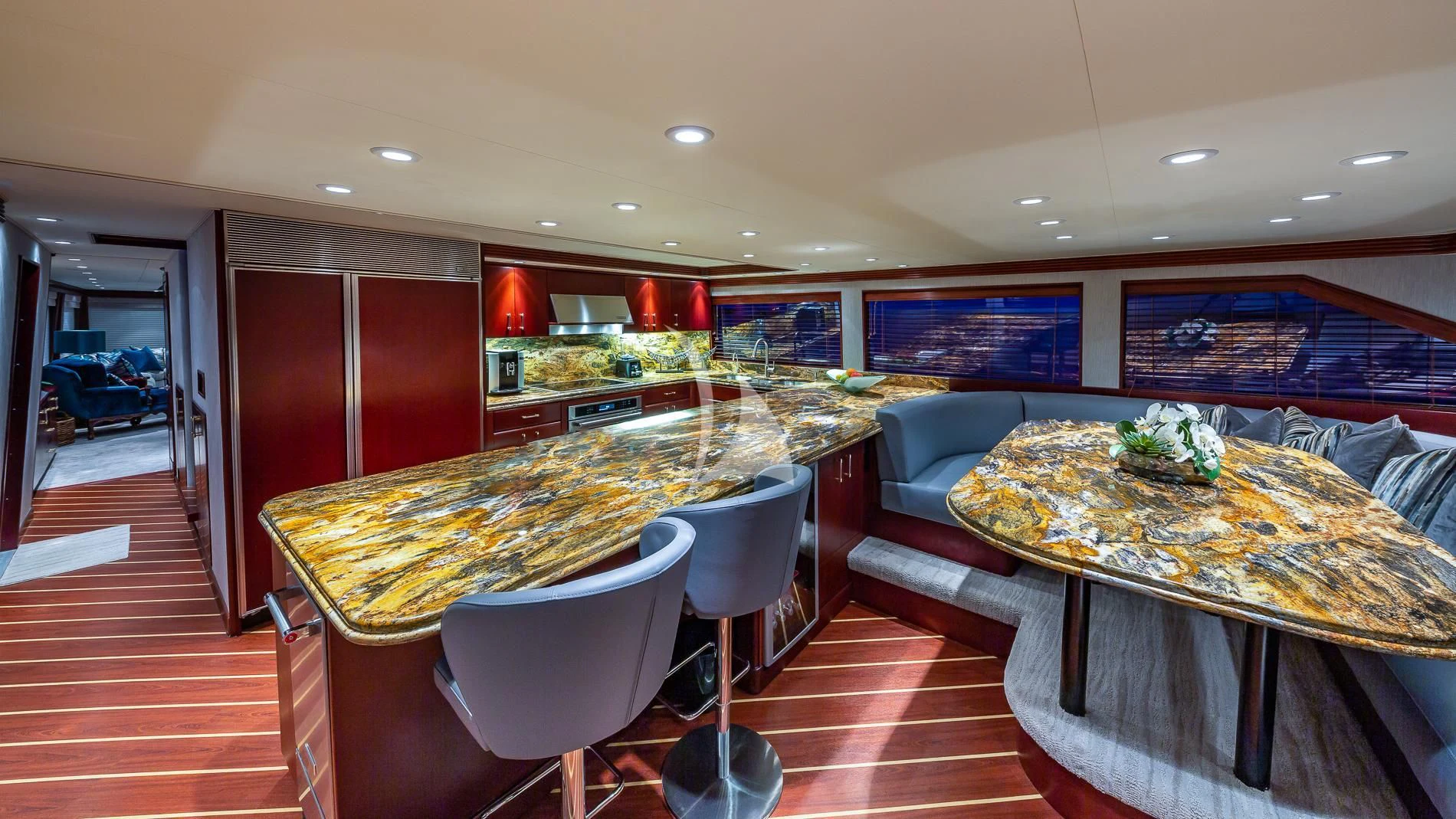 a room with a table and chairs aboard DESTINY Yacht for Sale
