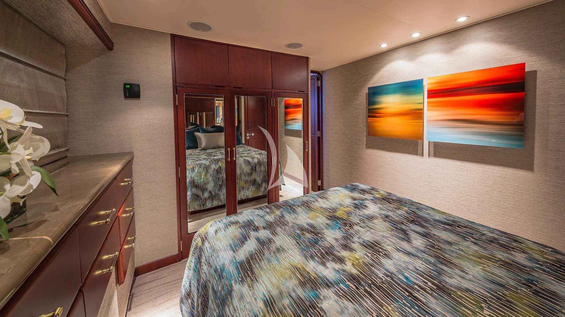 a bedroom with a bed and a desk aboard DESTINY Yacht for Sale