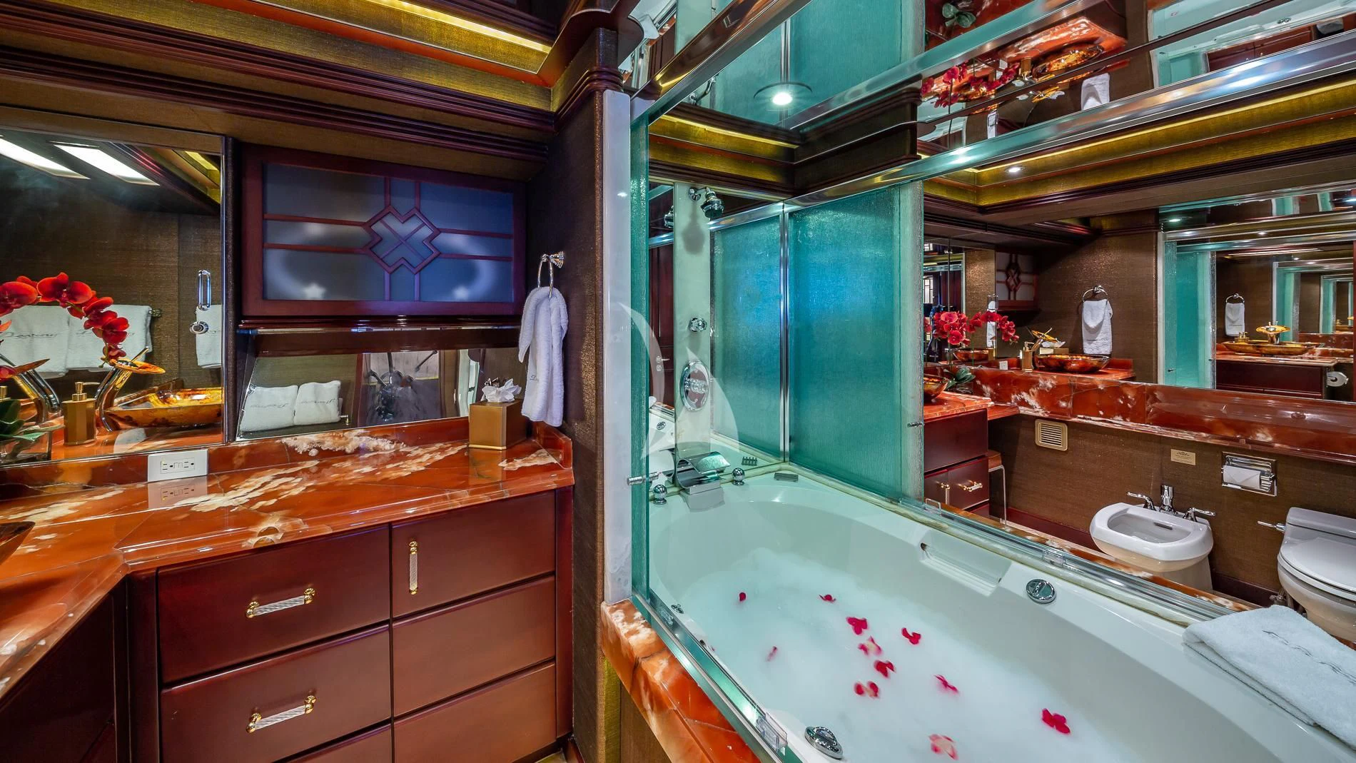 a bathroom with a tub and cabinets aboard DESTINY Yacht for Sale