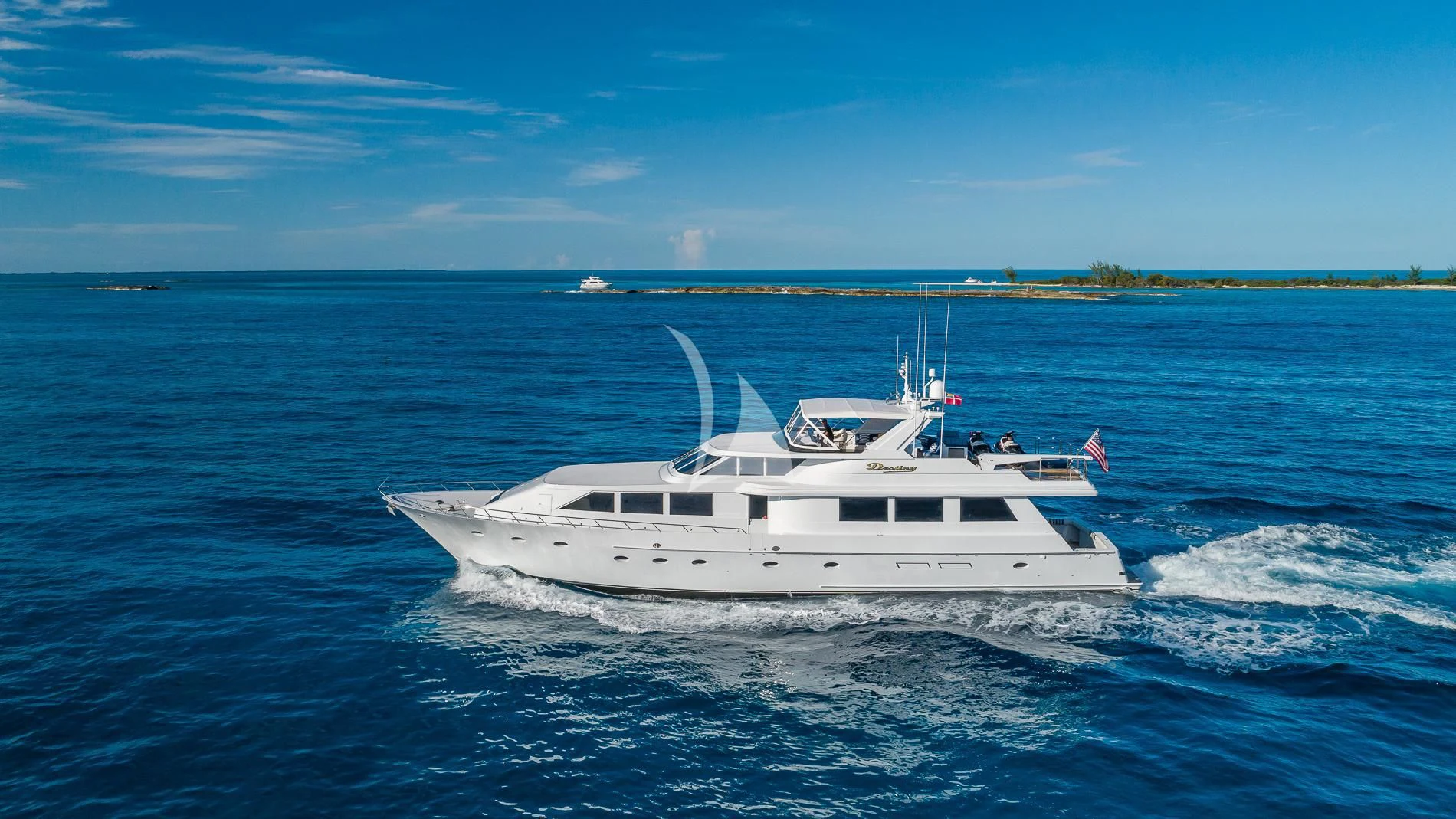 a white boat on the water aboard DESTINY Yacht for Sale
