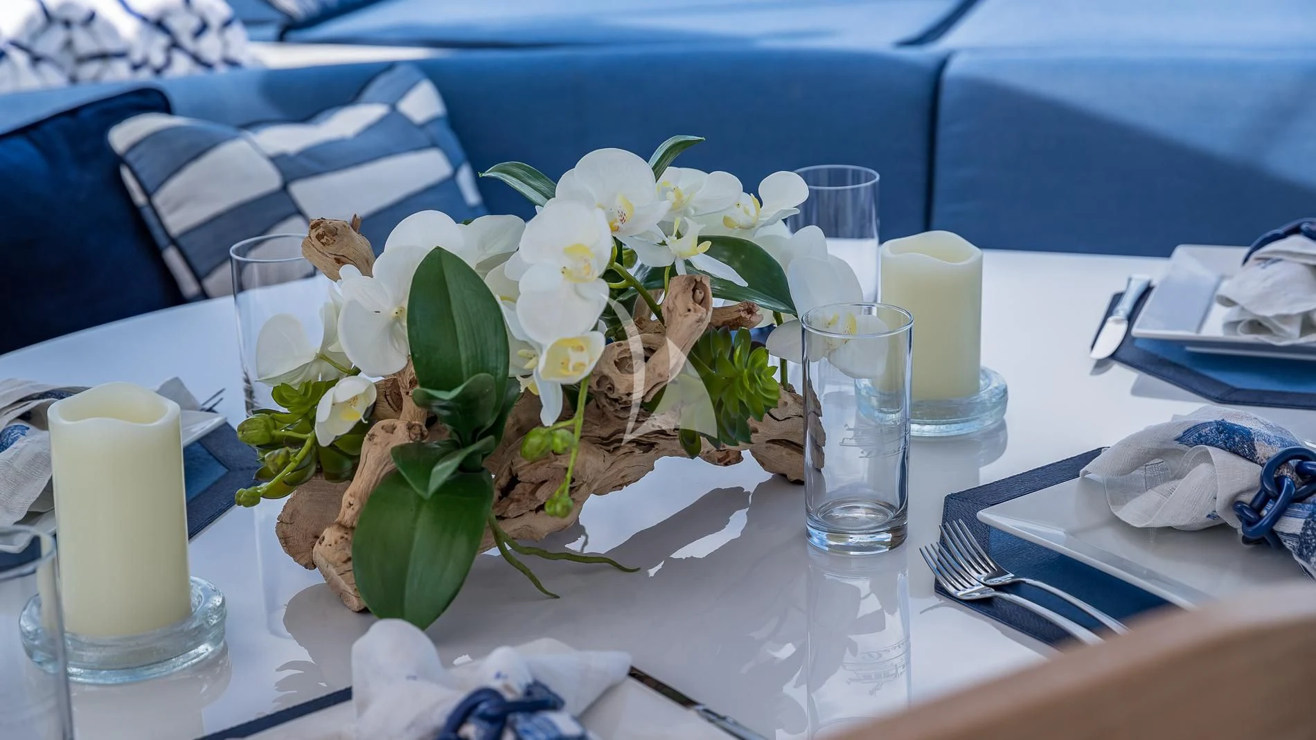 a table with flowers and candles aboard DESTINY Yacht for Sale