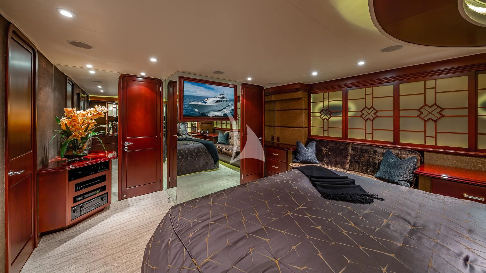 a bedroom with a large bed aboard DESTINY Yacht for Sale