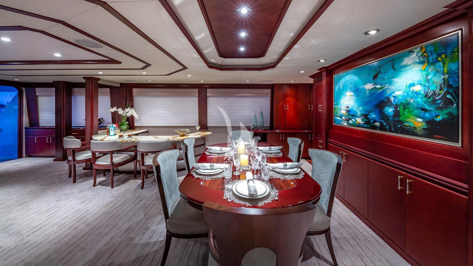 a restaurant with tables and chairs aboard DESTINY Yacht for Sale