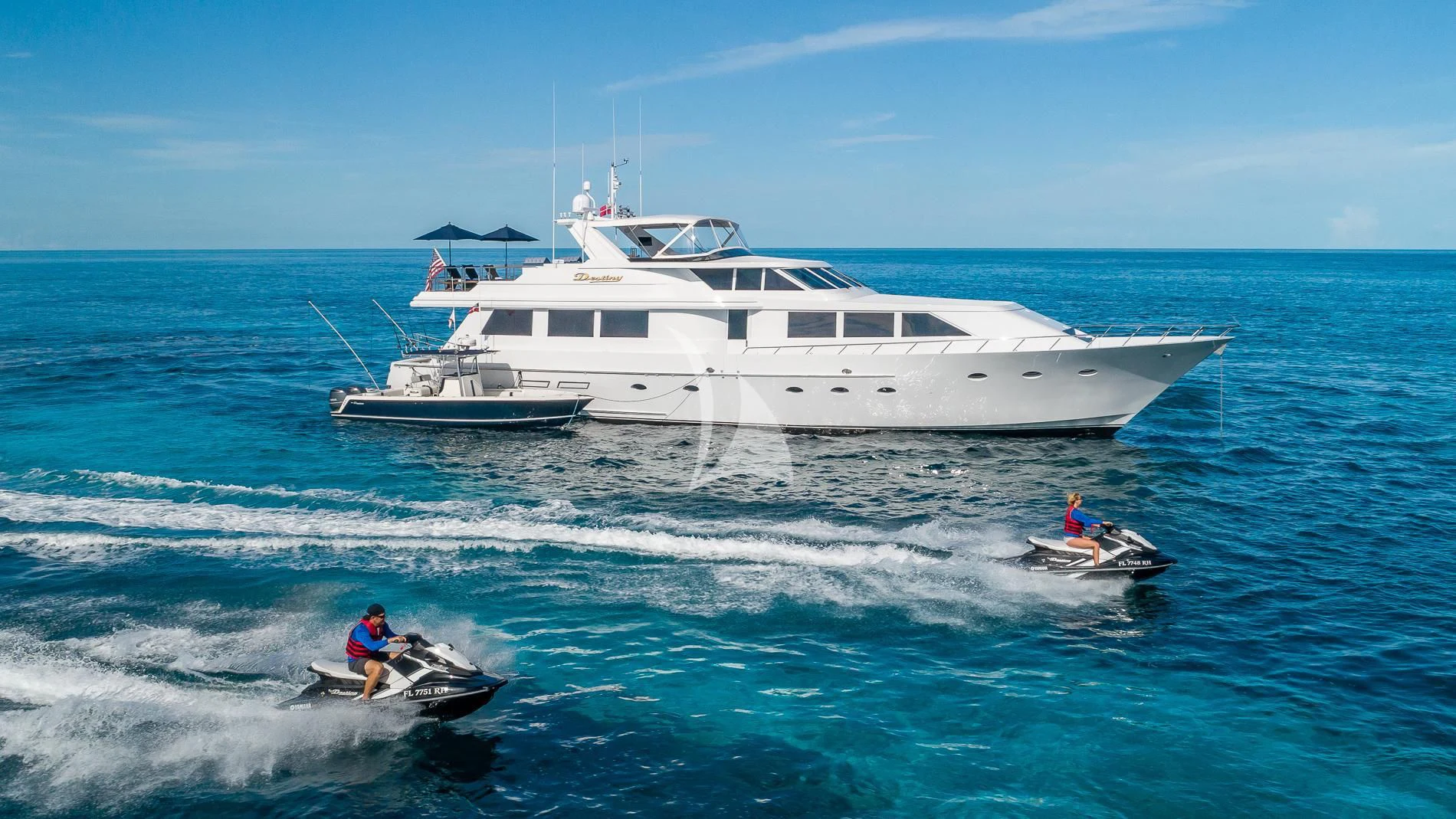 a couple of people in a boat on the water aboard DESTINY Yacht for Sale
