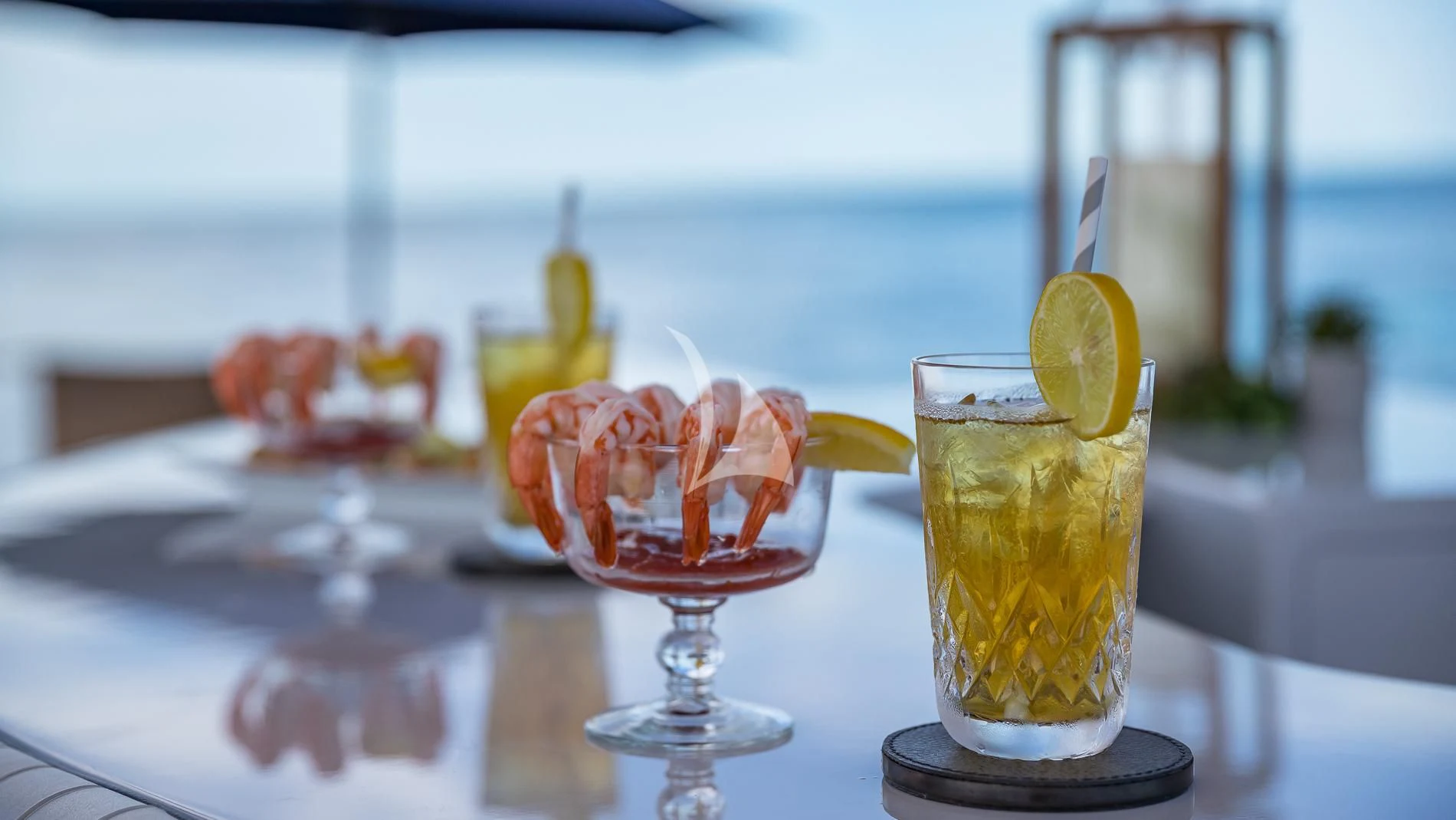 a group of glasses with colorful drinks aboard DESTINY Yacht for Sale