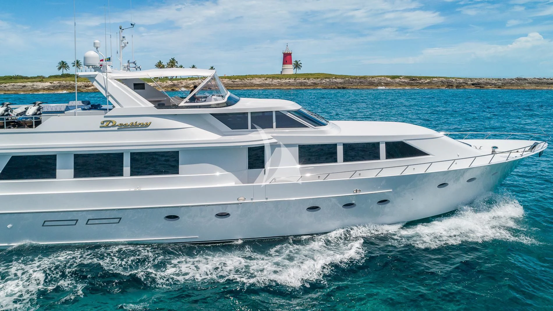 a white yacht in the water aboard DESTINY Yacht for Sale