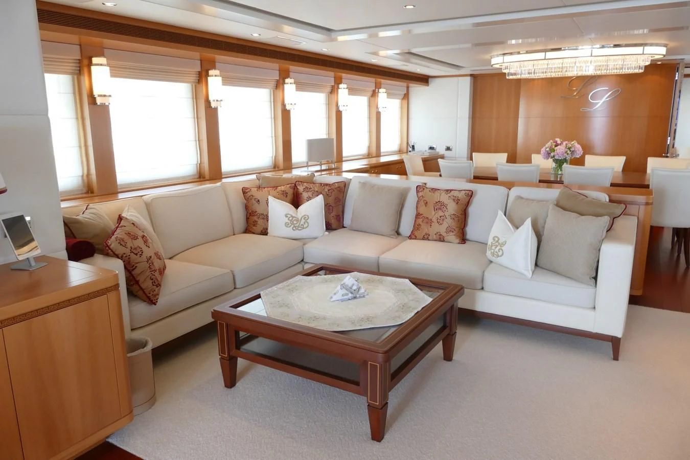 a living room with a couch and a coffee table aboard MORDAN Yacht for Sale