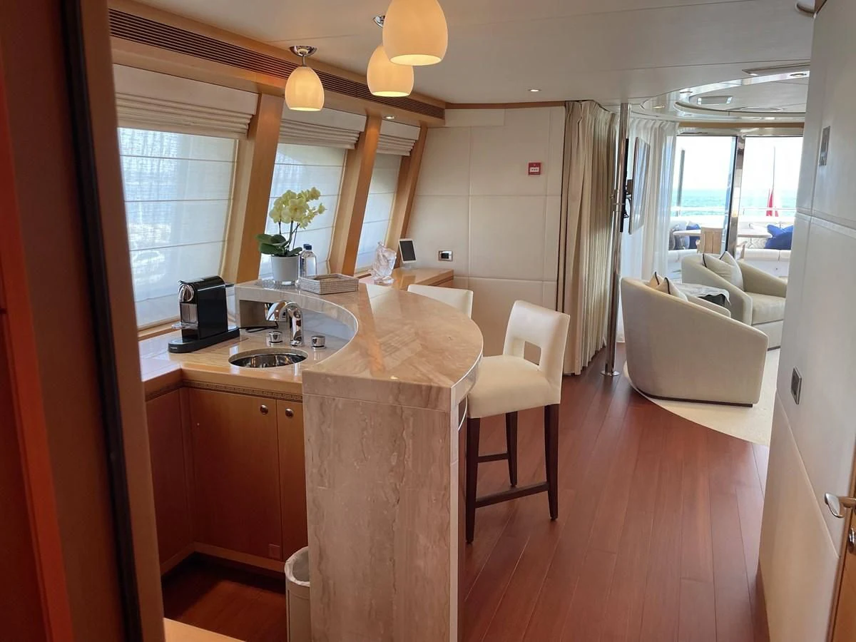 a kitchen with a sink and a table aboard MORDAN Yacht for Sale