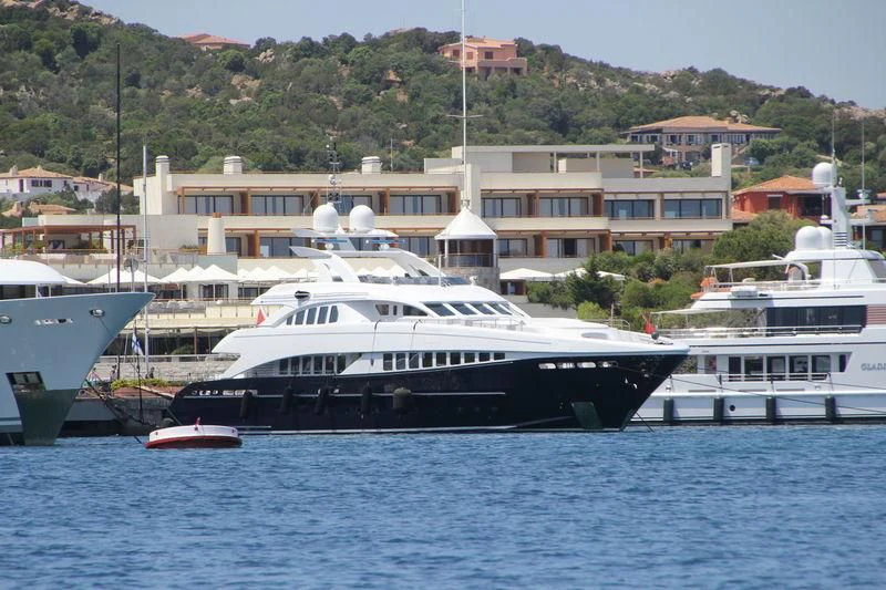 a large white boat sits in the water aboard MORDAN Yacht for Sale