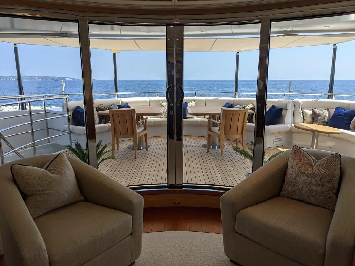 a room with a view of the ocean and the deck aboard MORDAN Yacht for Sale