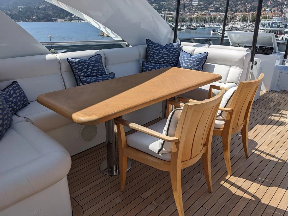 a table and chairs on a deck aboard MORDAN Yacht for Sale