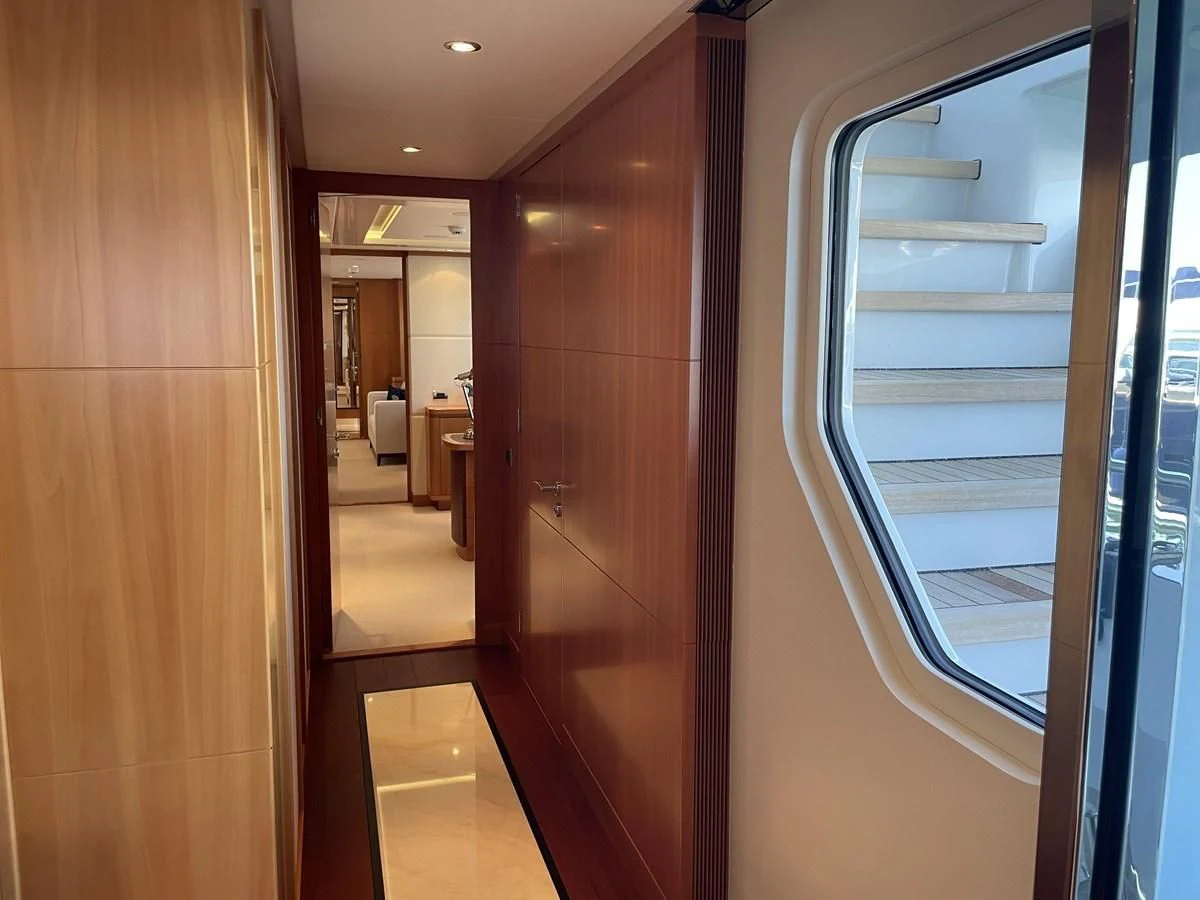 a hallway with glass doors aboard MORDAN Yacht for Sale