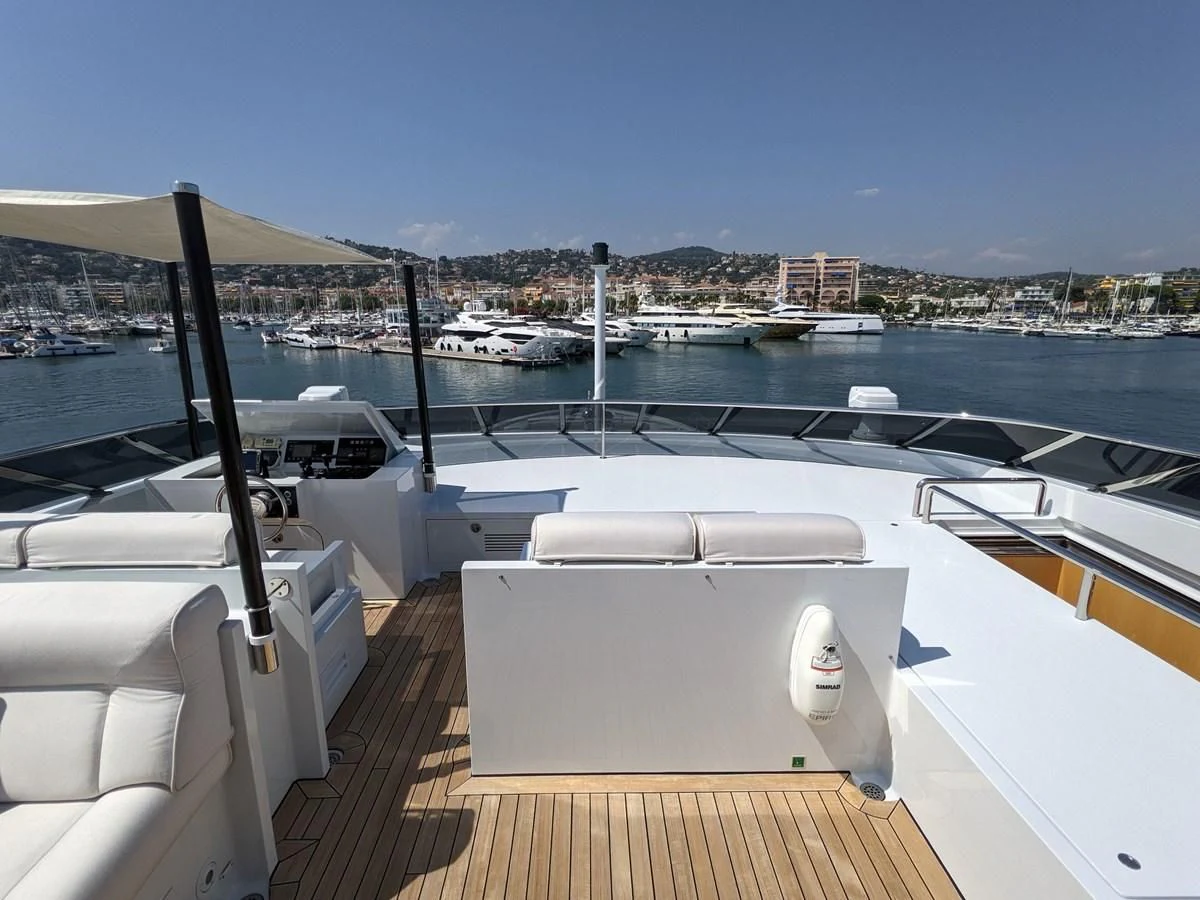 a deck with a view of a city and water aboard MORDAN Yacht for Sale