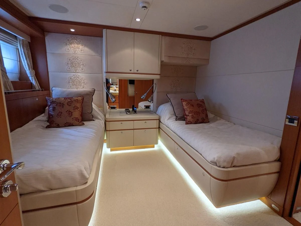 a room with two beds aboard MORDAN Yacht for Sale