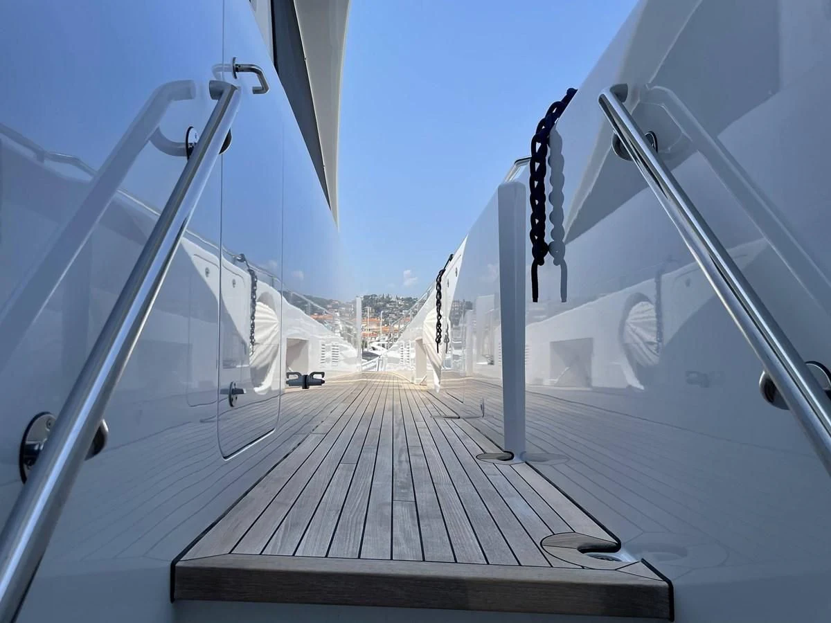 a wooden walkway with a railing aboard MORDAN Yacht for Sale