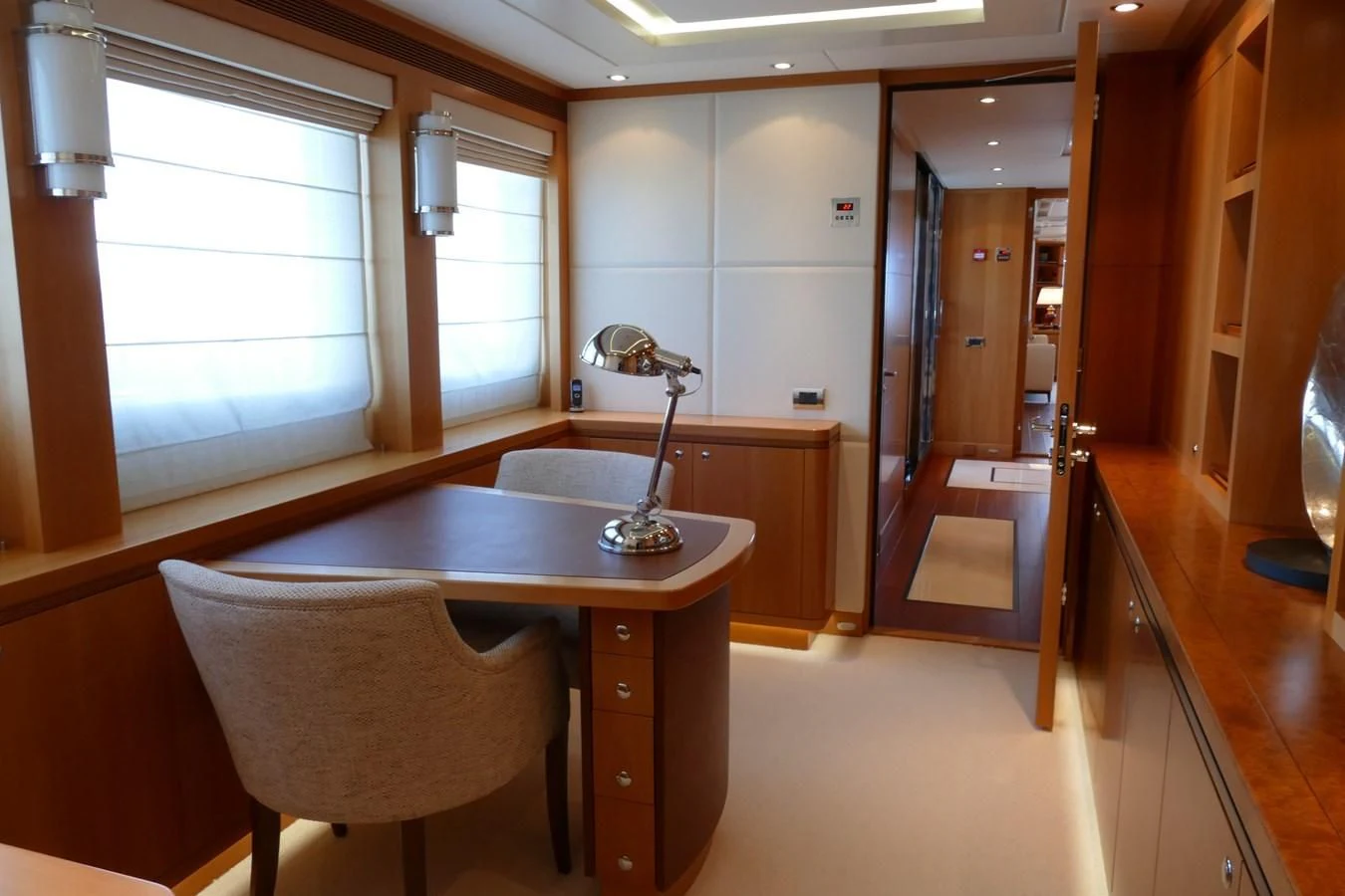 a kitchen with a table and chairs aboard MORDAN Yacht for Sale