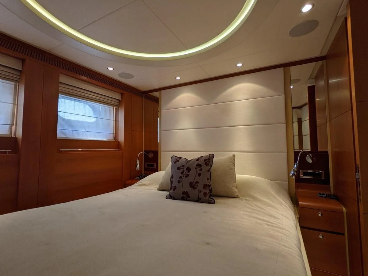 a bed with pillows aboard MORDAN Yacht for Sale