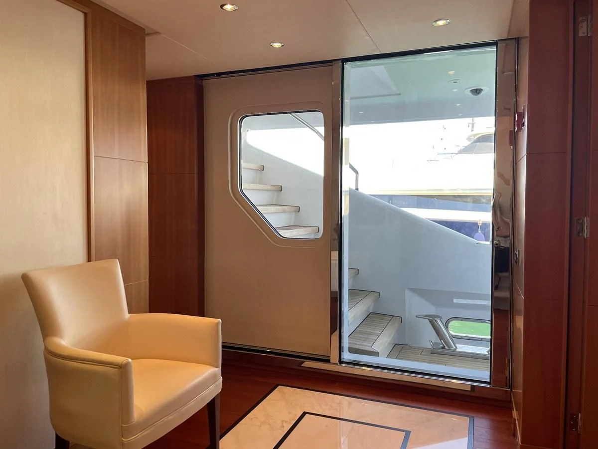 a room with a sliding glass door aboard MORDAN Yacht for Sale
