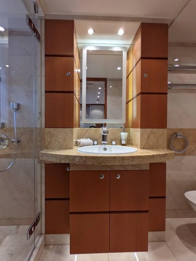 a bathroom with a sink and a shower aboard MORDAN Yacht for Sale