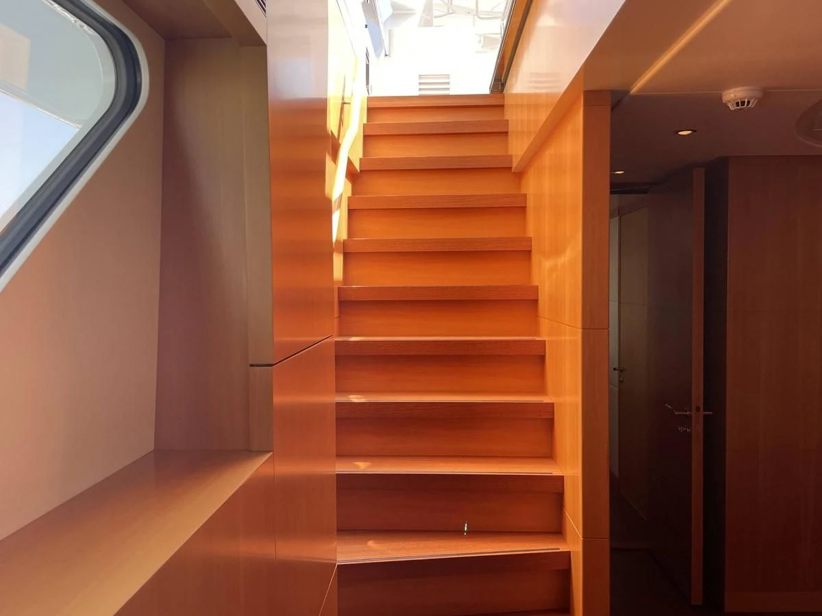a wooden staircase in a building aboard MORDAN Yacht for Sale