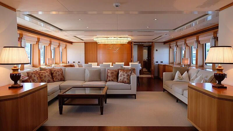a living room with a couch and a coffee table aboard MORDAN Yacht for Sale