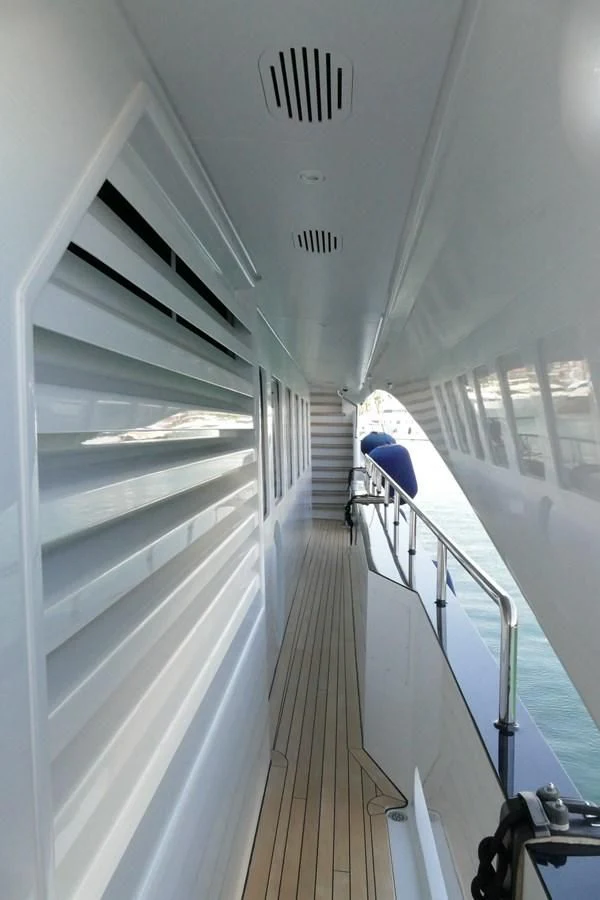 a hallway with a blue umbrella aboard MORDAN Yacht for Sale