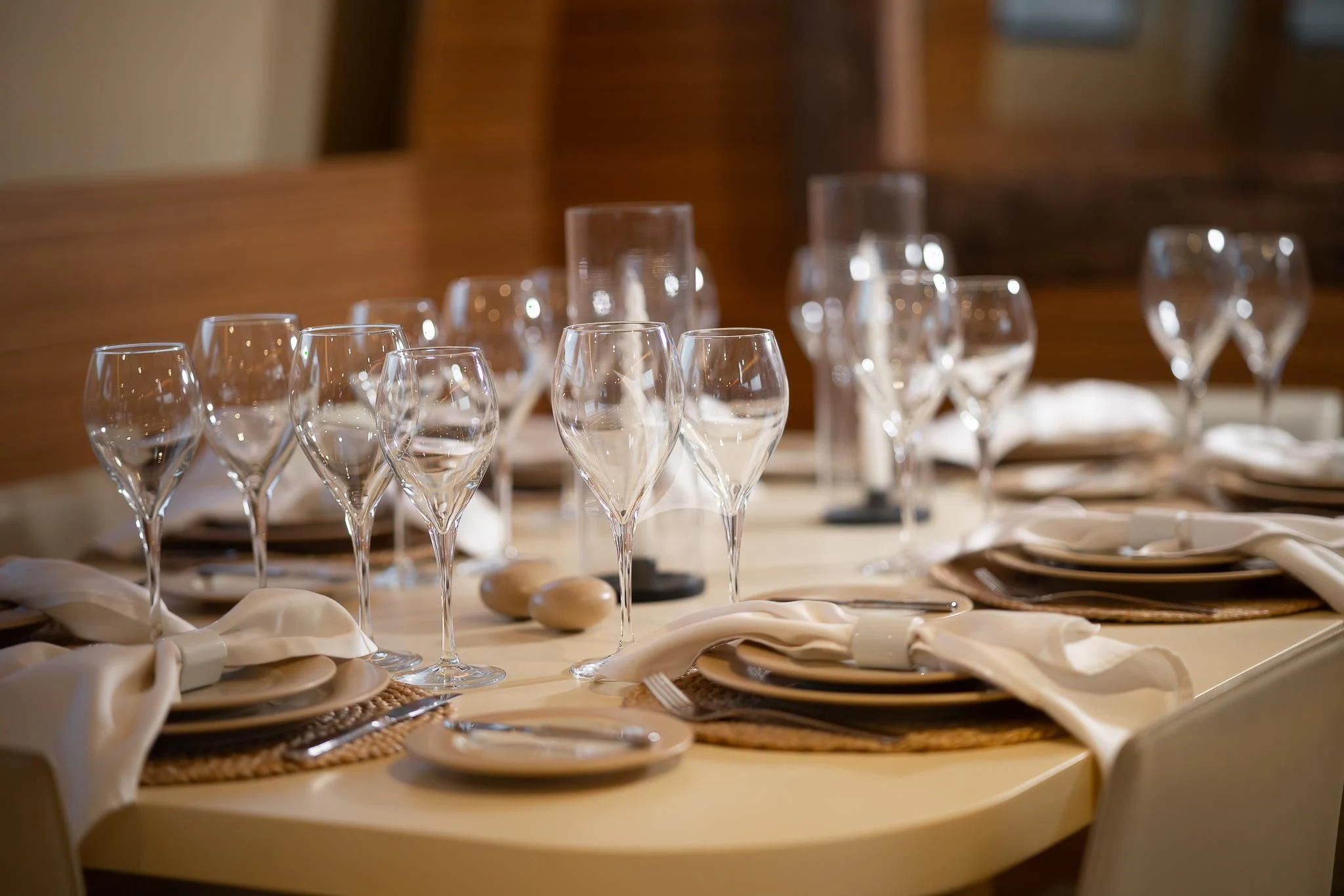 a table with many glasses and plates aboard GIOE I Yacht for Sale
