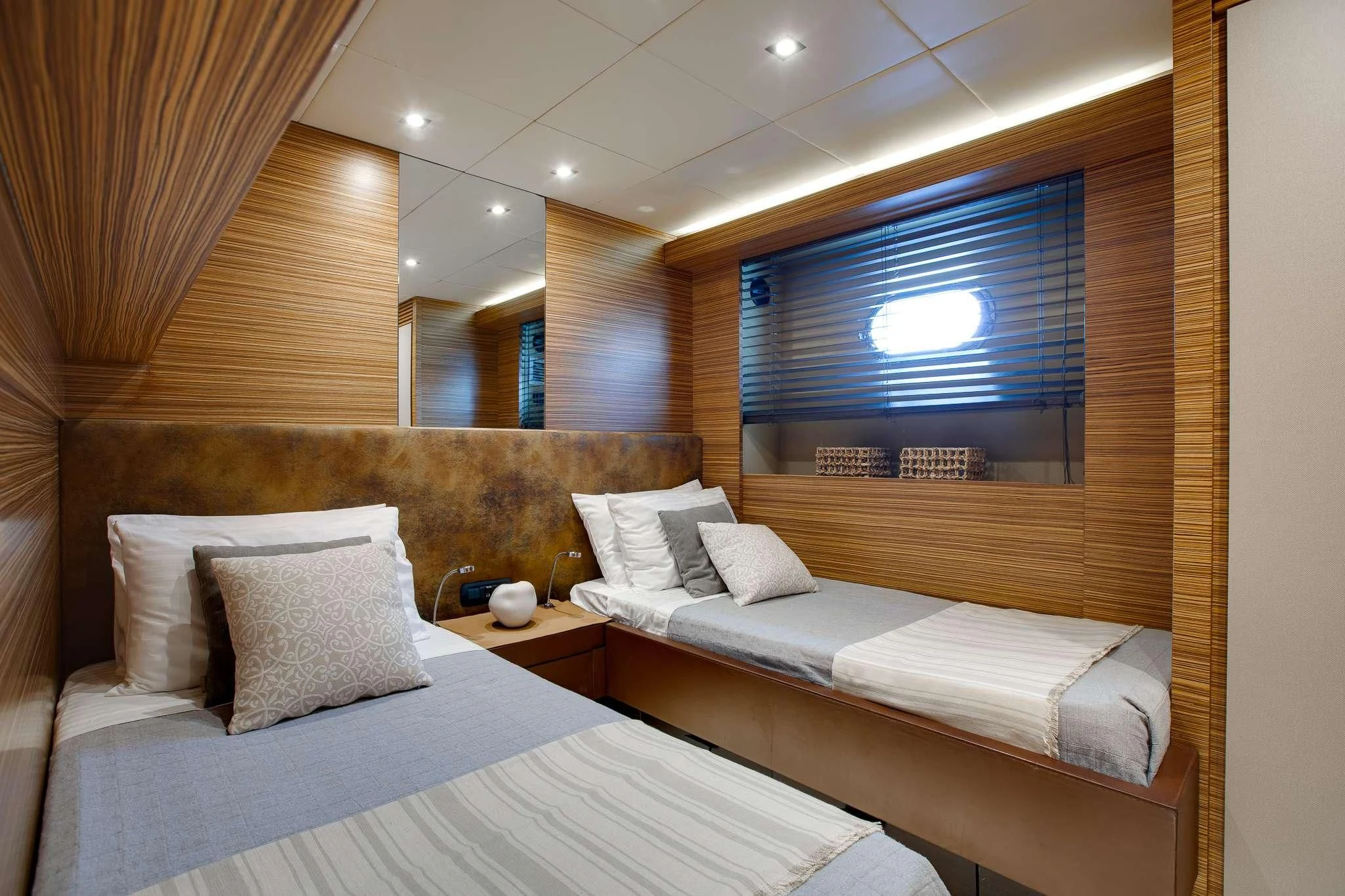 a room with two beds aboard GIOE I Yacht for Sale