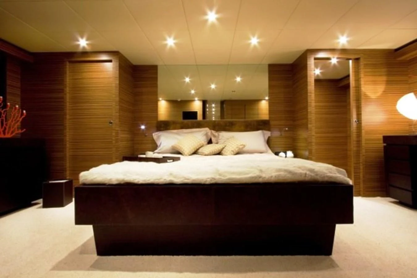 a large bed in a room aboard GIOE I Yacht for Sale