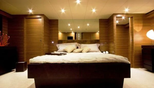 a large bed in a room aboard GIOE I Yacht for Sale