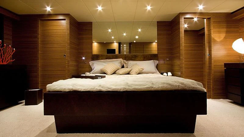 a large bed in a room aboard GIOE I Yacht for Sale