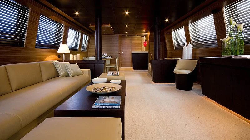 a living room with a couch and a coffee table aboard GIOE I Yacht for Sale
