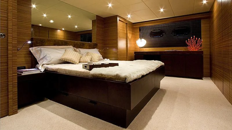 a large bed in a room aboard GIOE I Yacht for Sale