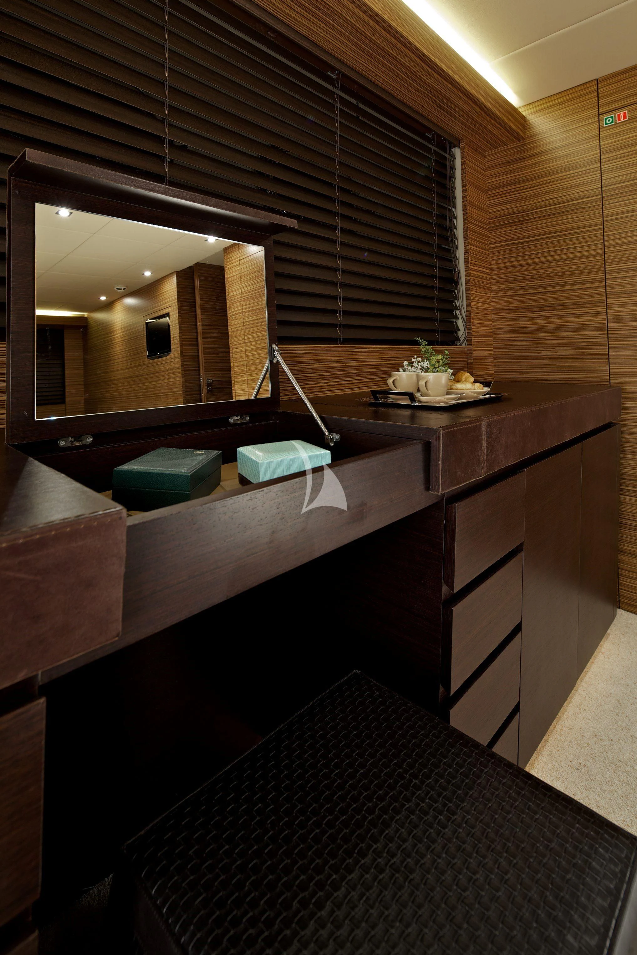 a room with a desk and a mirror aboard GIOE I Yacht for Sale