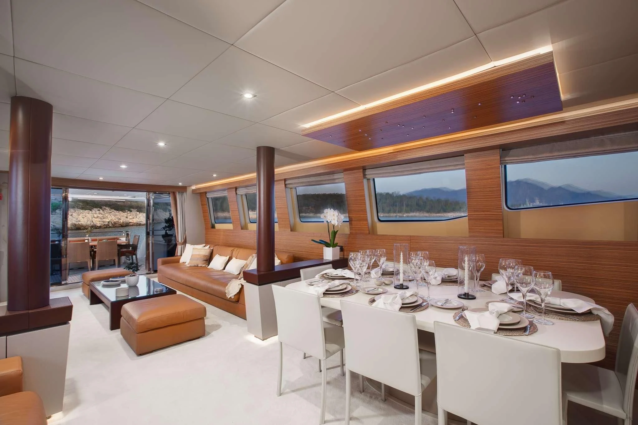 a room with tables and chairs aboard GIOE I Yacht for Sale