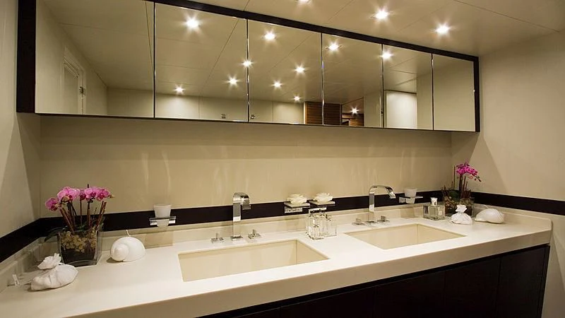 a bathroom with sinks and mirrors aboard GIOE I Yacht for Sale