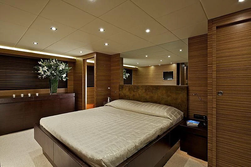 a room with a bed and a wood door aboard GIOE I Yacht for Sale