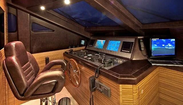 a room with a desk and computer aboard GIOE I Yacht for Sale