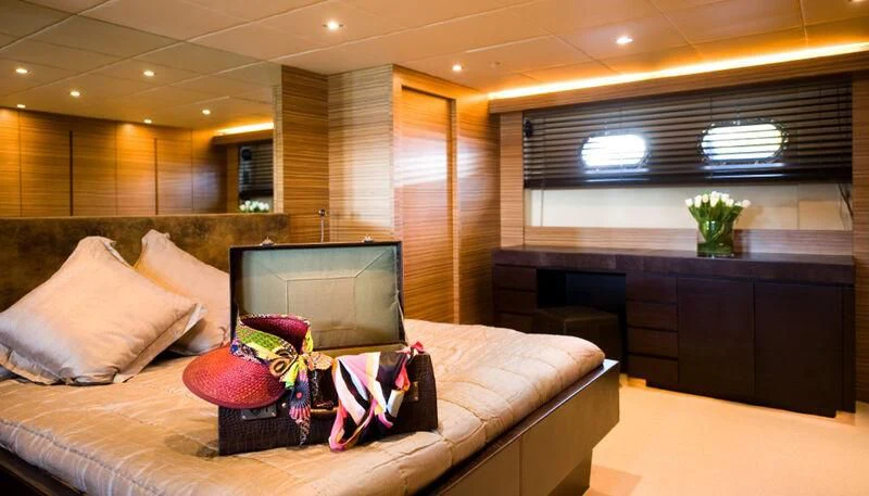 a room with a bed and a tv aboard GIOE I Yacht for Sale