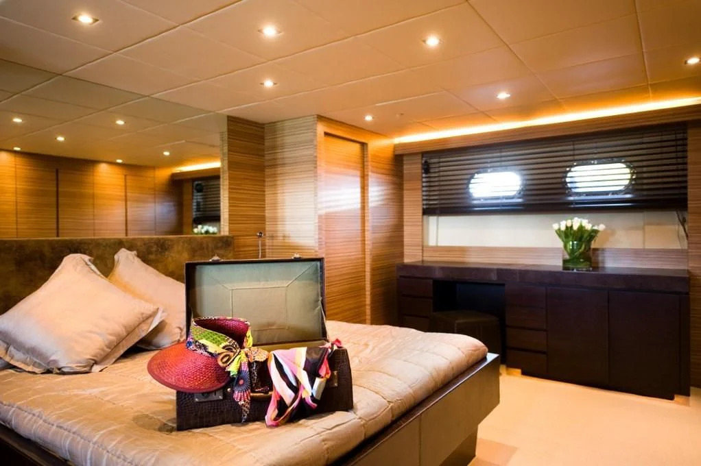 a room with a laptop and a couch aboard GIOE I Yacht for Sale