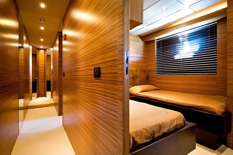 a room with a bed and a window aboard GIOE I Yacht for Sale