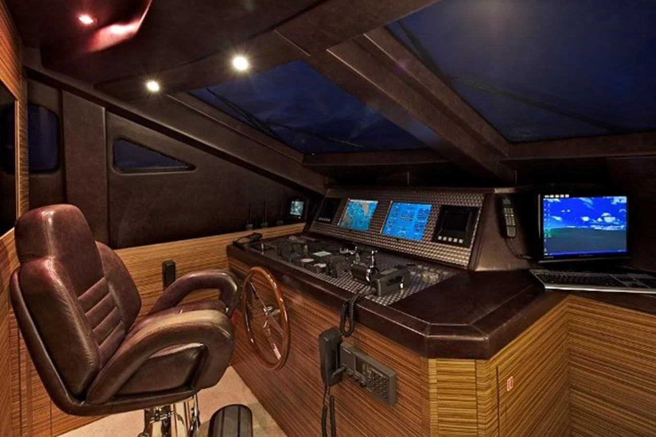 a room with a desk and laptops aboard GIOE I Yacht for Sale